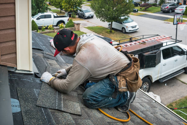 Professional Hail Damage Roof Repair technician working in Fields, OR